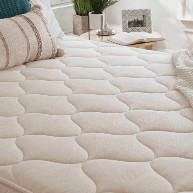 White mattress in a bedroom setting