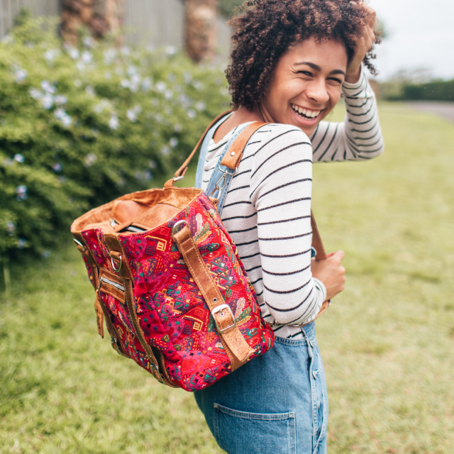 Woman smiling with a backpack