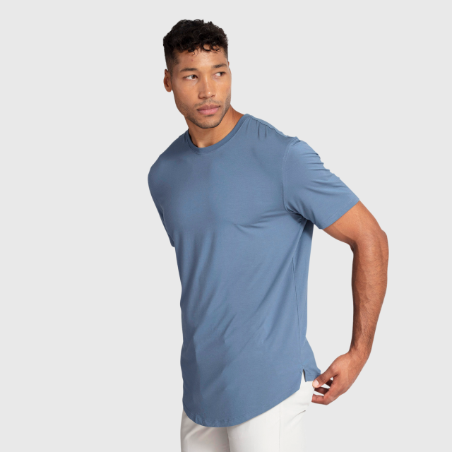 Man posing in a blue t-shirt