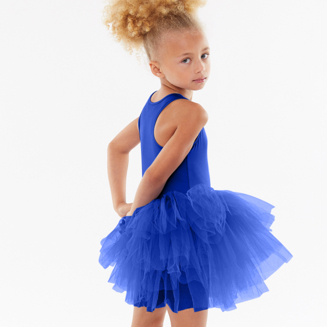 Child posing in a blue dress