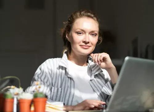 Entrepreneur on her laptop in the sunlight