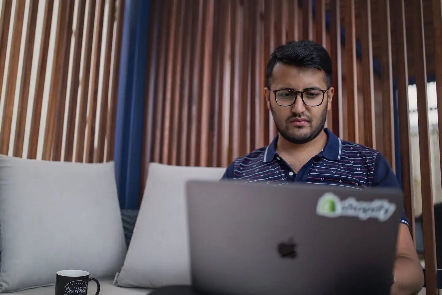 Shopify store owner on his laptop